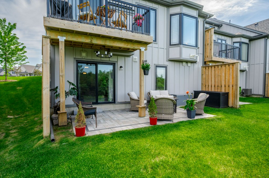 80 Marsh Avenue, Unit 78 - Exterior, grey siding, raised deck and patio