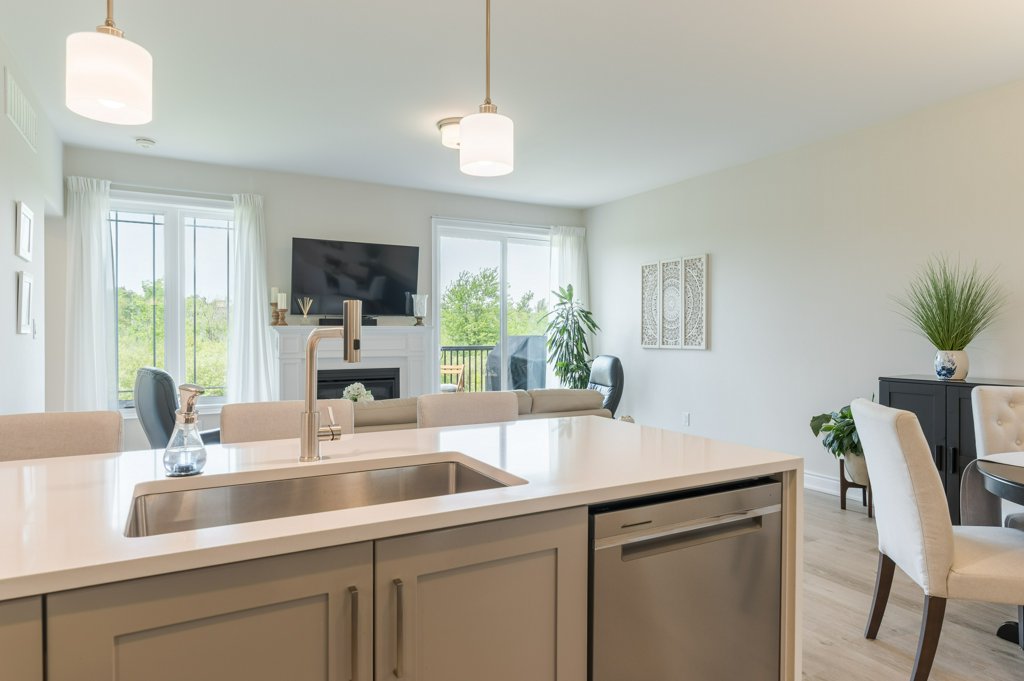 80 Marsh Avenue, Unit 78 - Kitchen island with living area beyond