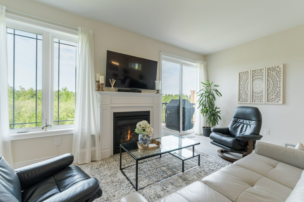 80 Marsh Avenue, Unit 78 - Living room with fireplace and sectional