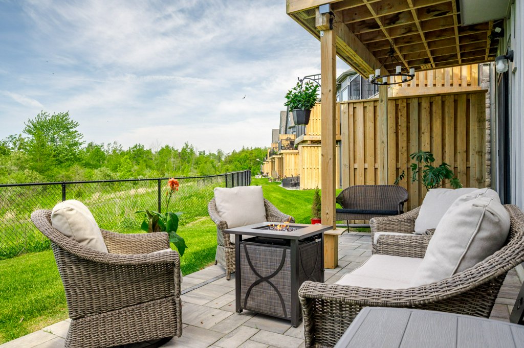 80 Marsh Avenue, Unit 78 - Covered patio with wicker seating and fire pit