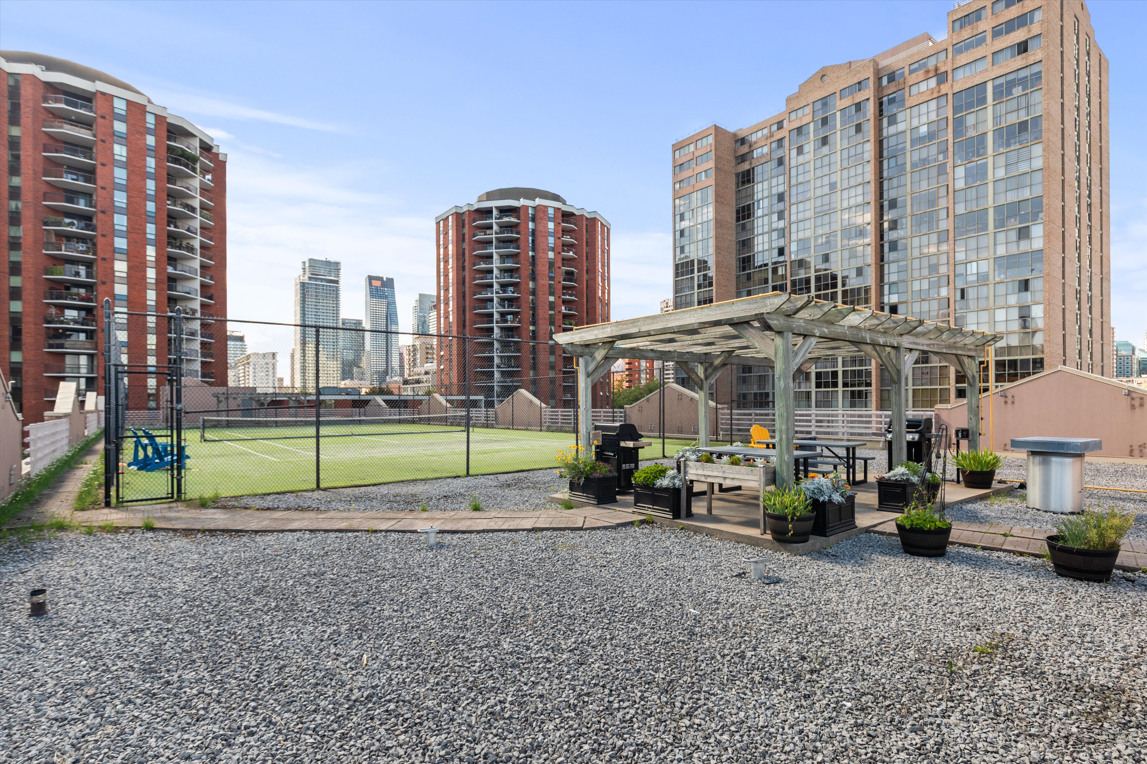 Rooftop tennis court and pergola
